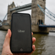 File photo illustration showing the Uber logo on a phone in front of Tower Bridge in London, England.